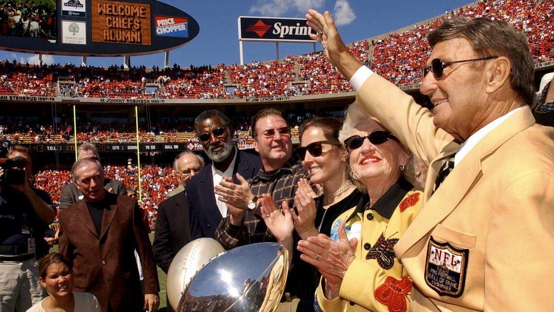 Former Kansas City Chiefs head coach Hank Stram, right, waves to Chiefs fans after Stram was inducted to the Pro Football Hall of Fame. He once coached the Chiefs against the Denver Broncos at Farrington Field. (Kansas City Star archives)
