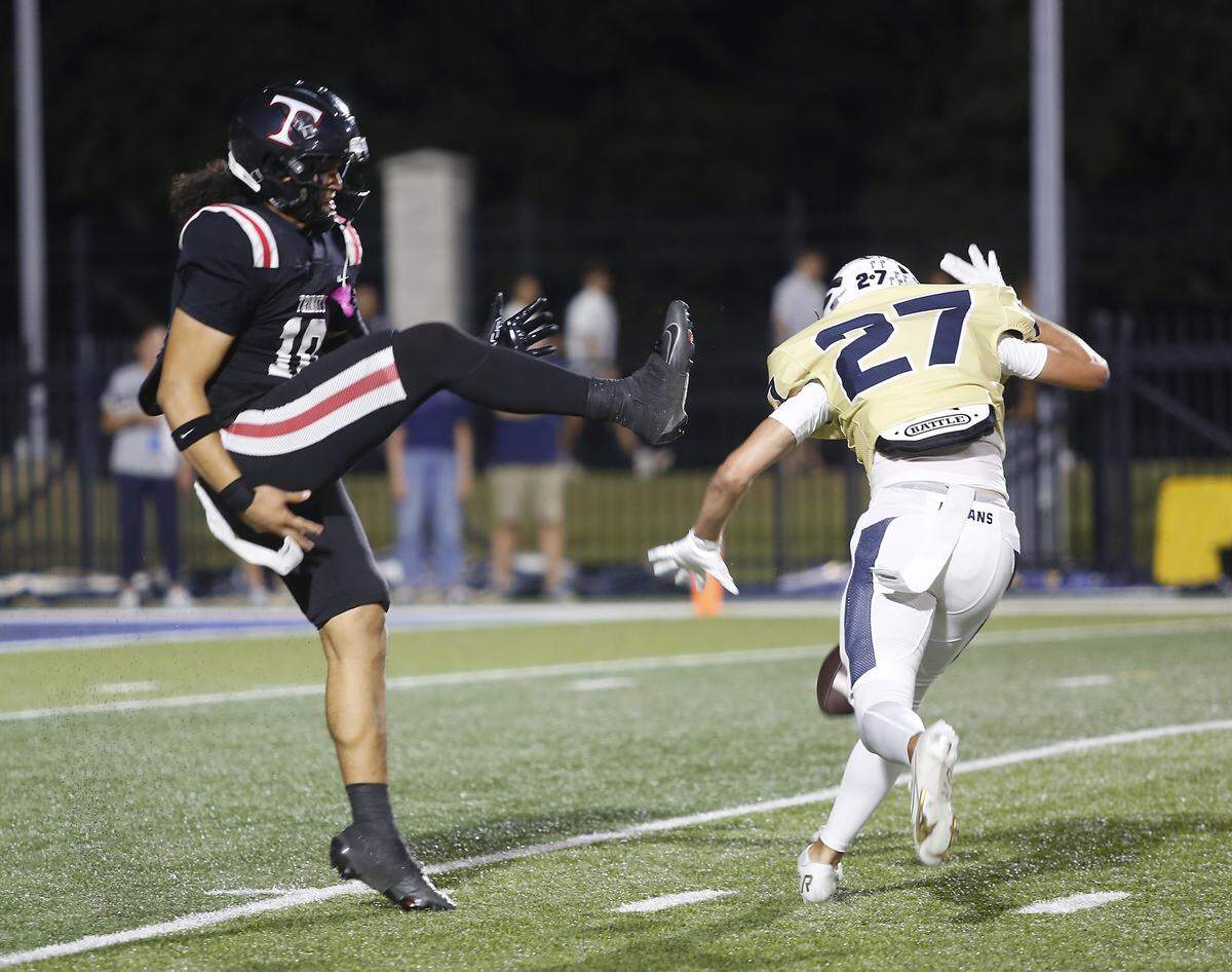 Keller’s Kingston Anderson (27) blocks a punt by Euless Trinity’s Sir Mimms during their game on Friday, October 17, 2025 at Pennington Field in Bedford, Texas.