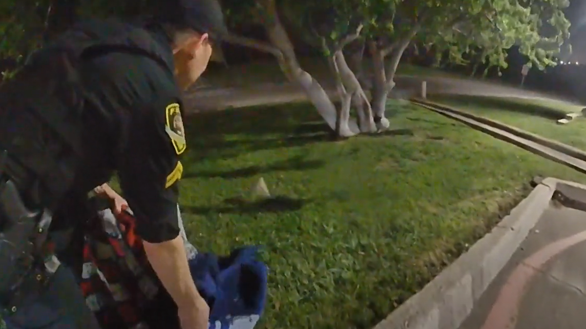 A White Settlement police officer releases a squirrel from a laundry basket after removing it from a resident’s apartment on Tuesday April 1, 2025.