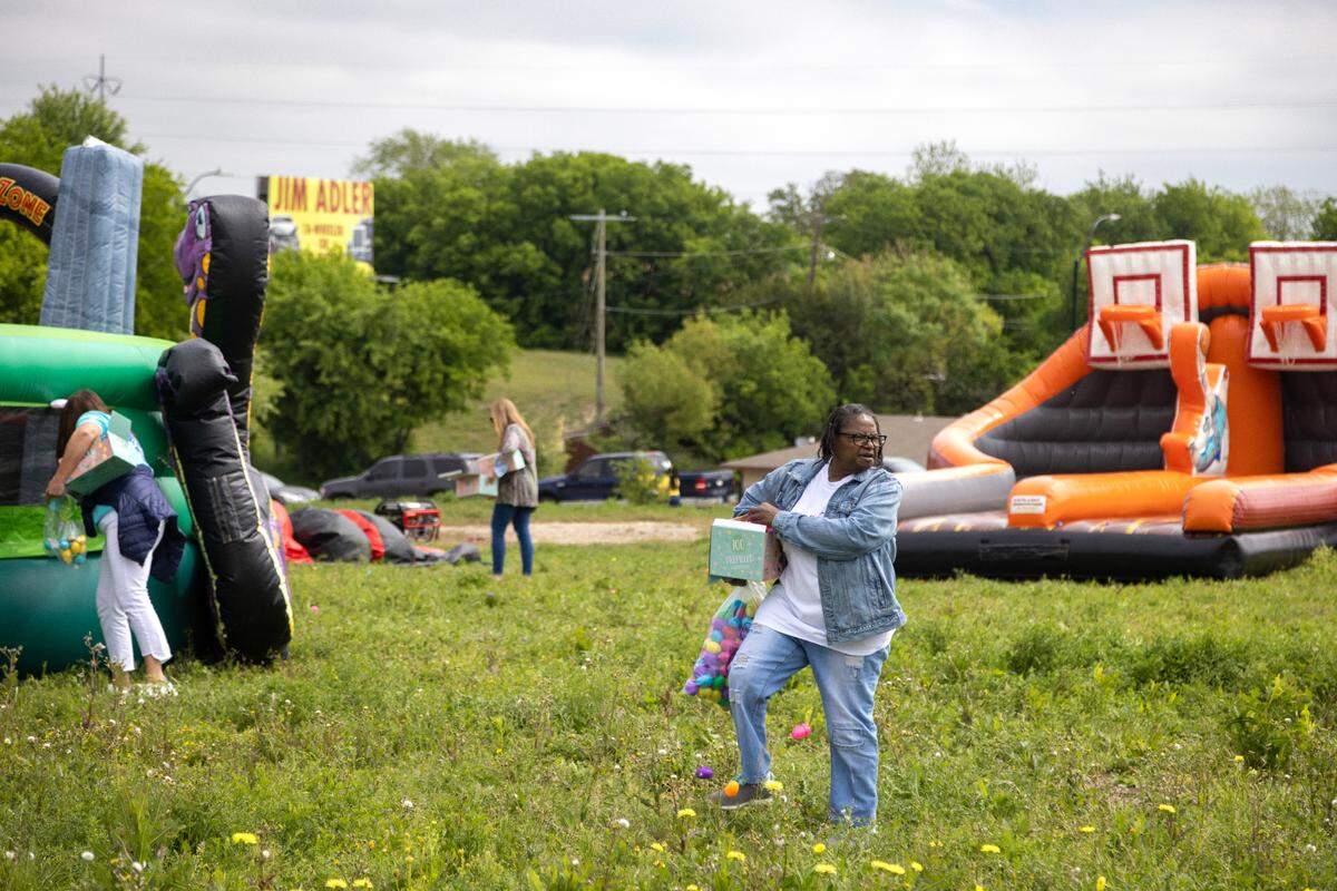 Long-time volunteer Michelle Allen hides eggs ahead of the annual Easter egg hunt at the Como Community Center in Fort Worth on Saturday, April 8, 2023. Allen worked for the Como Community Center for decades before retiring and continuing to volunteer.