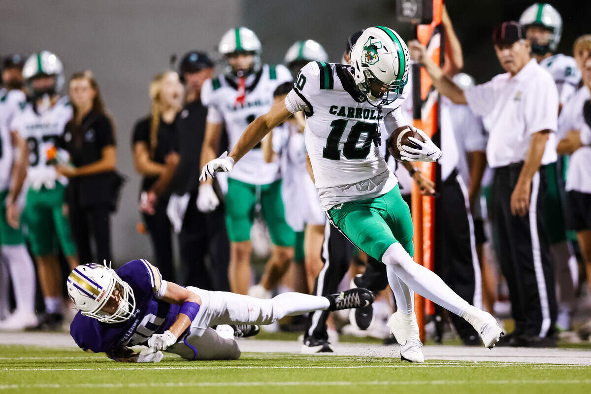 Southlake Carroll wide receiver Brody Knowles (10) runs past a Keller Timber Creek defender down the sideline during a district matchup on Thursday, September 25, 2025 at Keller ISD Stadium in Keller, Texas.