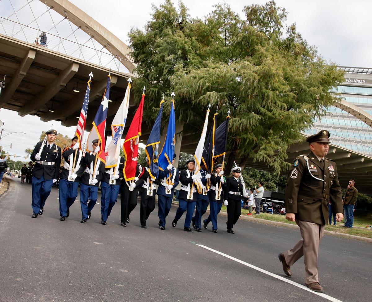 Flags from all branches of the military along with those of the United States and Texas were carried by Fort Worth JROTC members during the 2023 Tarrant County Veterans Day Parade in Fort Worth on Saturday.