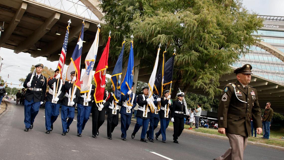 Flags from all branches of the military along with the US and Texas were carried by Fort Worth JROTC members during the 2023 Tarrant County Veterans Day Parade in Fort Worth, Texas, Saturday, Nov. 11, 2023. Veterans Day, formally known as Armistice Day, marks the WW1 allies signing the treaty with Germany at Compiegne France. (Special to the Star-Telegram Bob Booth)