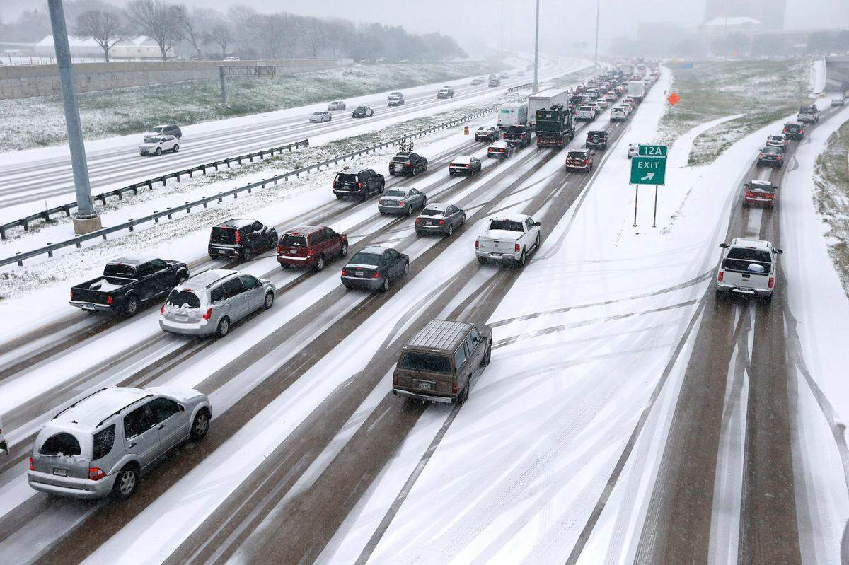 Feb. 27, 2015: Eastbound traffic crawls along a snow-covered I-30 from Montgomery Avenue in Fort Worth.