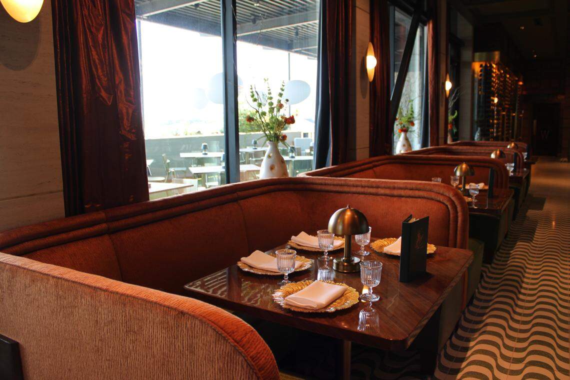Cozy booths line the window ridden walls for a comfy seat and a spectacular view.
