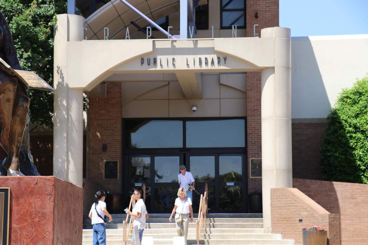People exiting the Grapevine Public Library on Election day.