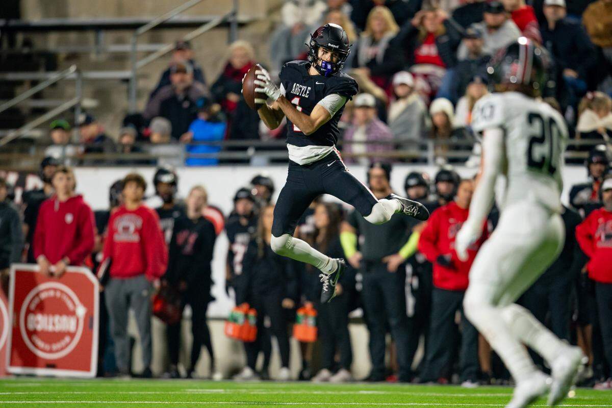 Argyle wide receiver Will Krzysiak makes a leaping catch in a playoff game against Colleyville Heritage.