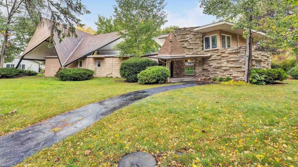 The Green Bay home has a distinct rooftop.
