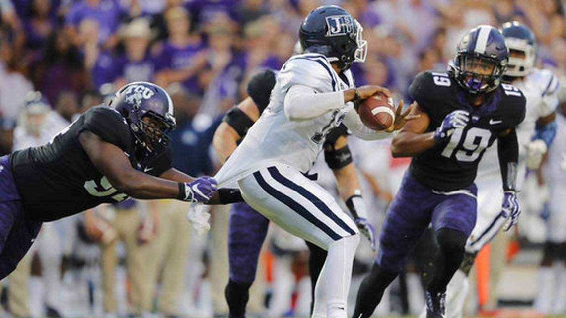 TCU defensive lineman Corey Bethley (94) grabs the jersey of Jackson State quarterback Brent Lyles (12) during the first quarter of an NCAA college football game in Fort Worth, Texas, Saturday, Sept. 2, 2017. (Rodger Mallison/Star-Telegram via AP)