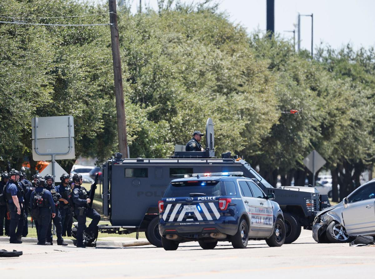 A police standoff in North Richland Hills on Davis Boulevard on Saturday, Aug. 3, 2024, ended when officers fired several rounds of gas through the suspect’s front windshield. The suspect was taken into custody.