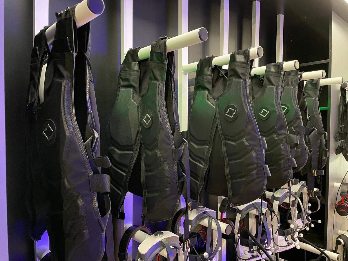 Haptic vests and virtual reality headsets await players at Sandbox VR, Thursday, Aug. 11, 2022, in Fort Worth.