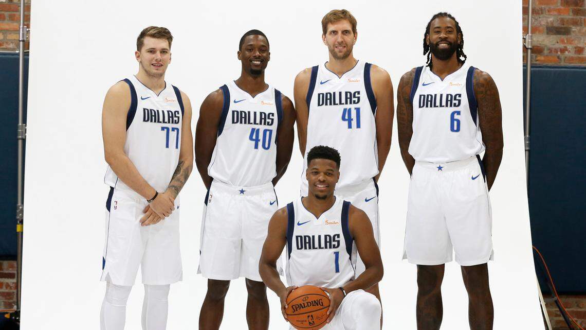 Newly acquired Dallas Mavericks center DeAndre Jordan (6) poses for a photo along with center Dirk Nowitzki (41), forward Harrison Barnes (40), guard Luka Doncic (77) and guard Dennis Smith Jr. (1) during the NBA basketball team’s media day in Dallas, Friday, Sept. 21, 2018.