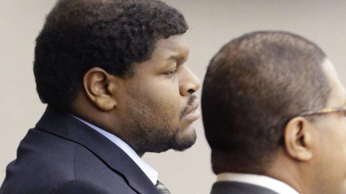 Josh Brent, left, former Dallas Cowboys NFL football player, listens with one of his lawyers Kevin Brooks while the punishment for his intoxication manslaughter conviction is read in court Friday, Jan. 24, 2014, in Dallas. Brent was sentenced to 180 days in jail and 10 years of probation for a drunken car crash that killed his friend and teammate, Jerry Brown. (AP Photo/Pool/LM Otero, Pool)