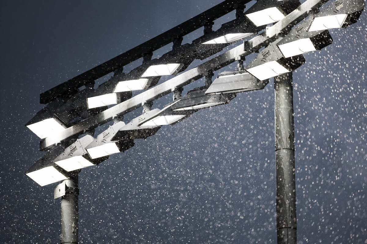 A stadium light is surrounded by rain during the UIL Texas high school baseball state championships at Dell Diamond in Round Rock, Texas, on Friday. June 5, 2026.