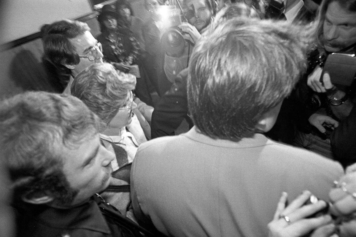 Candace (Candy) Montgomery with husband Pat, surrounded by the press, after a Collin County jury acquitted her.