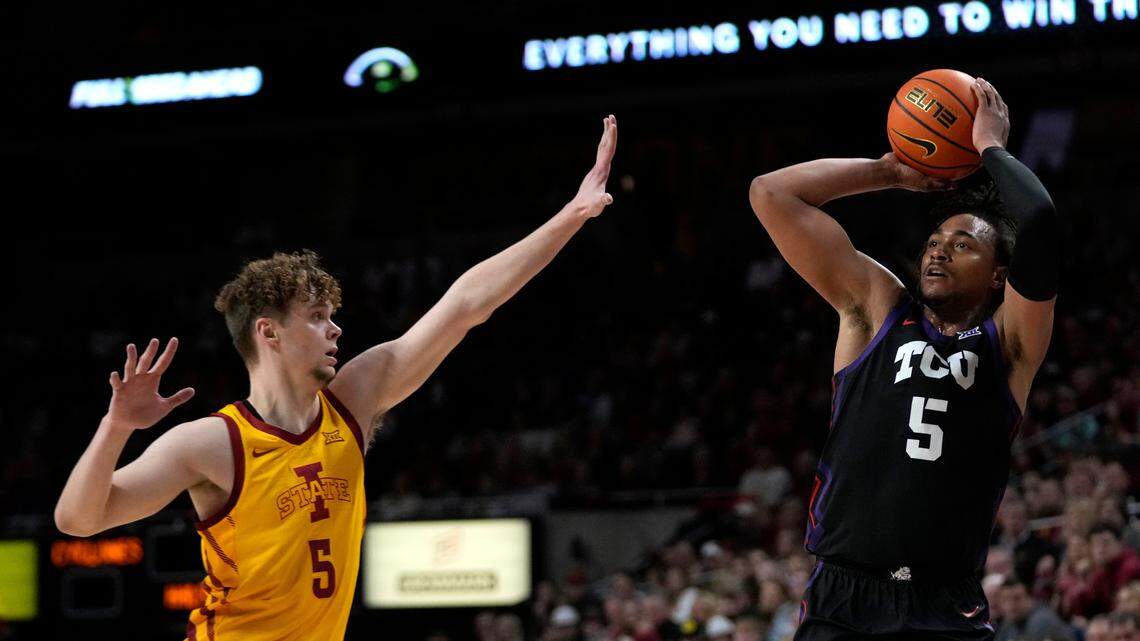 TCU forward Chuck O’Bannon Jr. shoots over Iowa State forward Aljaz Kunc, left, during the second half of an NCAA college basketball game, Wednesday, in Ames, Iowa.