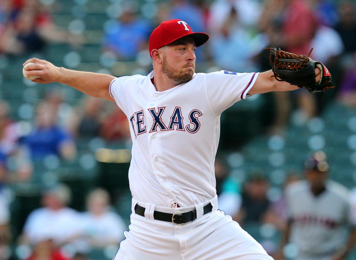 Texas Rangers starting pitcher Adrian Sampson (52) delivers a pitch against the Cleveland Indians in the first inning of a baseball game Tuesday, June 18, 2019, in Arlington, Texas. (Special to the Star-Telegram/ Richard W. Rodriguez)