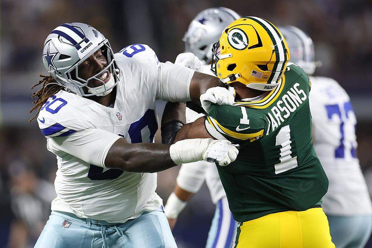 ARLINGTON, TEXAS - SEPTEMBER 28: Tyler Guyton #60 of the Dallas Cowboys works against Micah Parsons #1 of the Green Bay Packers during a game at AT&T Stadium on September 28, 2025 in Arlington, Texas. (Photo by Stacy Revere/Getty Images)