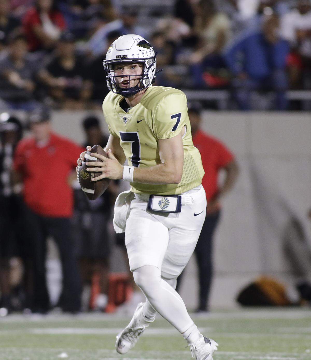 Keller quarterback Brock Burkett looks for a receiver against Euless Trinity during their game on Friday, October 17, 2025 at Pennington Field in Bedford, Texas.