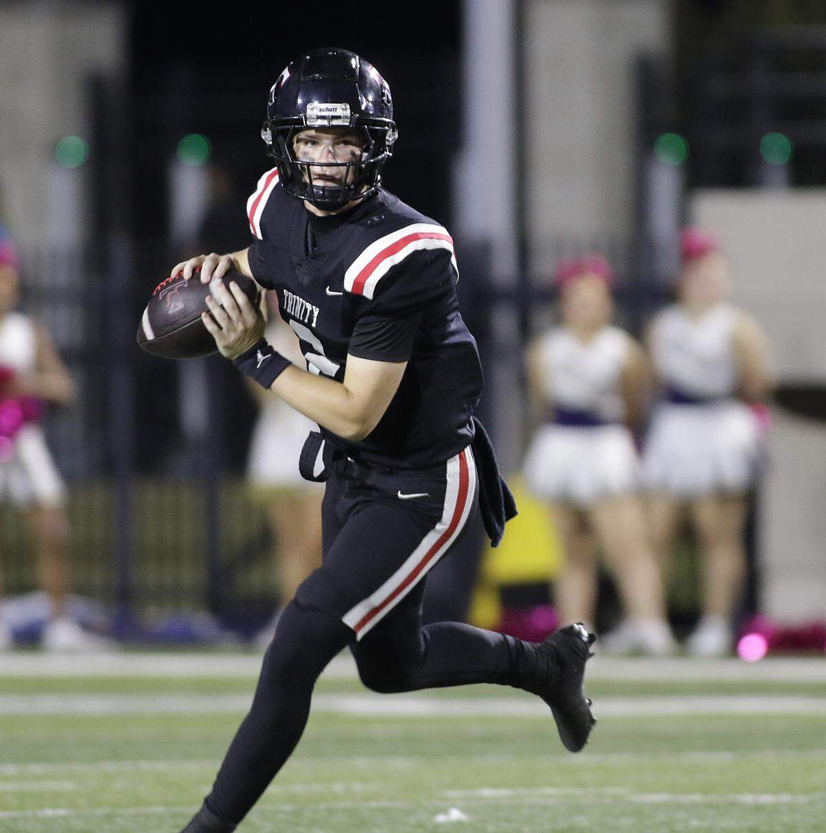 Euless Trinity’s Mack Lineweaver looks down field for a receiver against Keller during their game on Friday, October 17, 2025 at Pennington Field in Bedford, Texas.