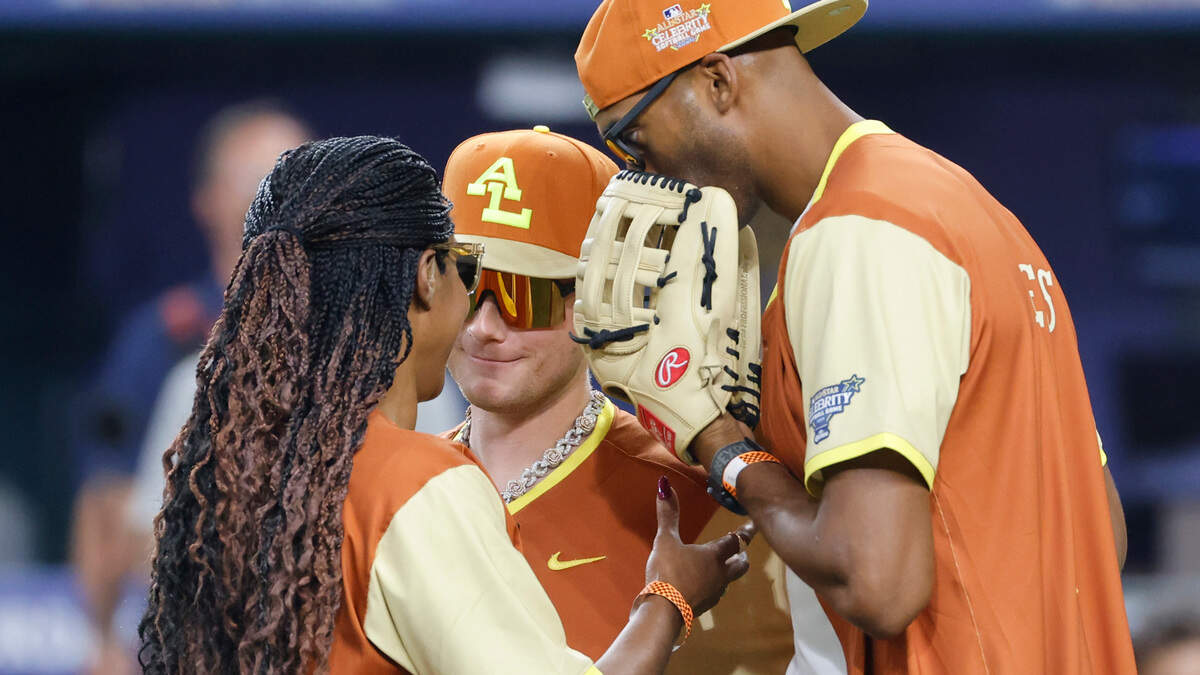 Tiffany Haddish, Matt James and Coach Al talk at the mound about Haddish’s pitching during the All-Star Celebrity Game at Globe Life Field in Arlington, Texas, Saturday July 13, 2024.