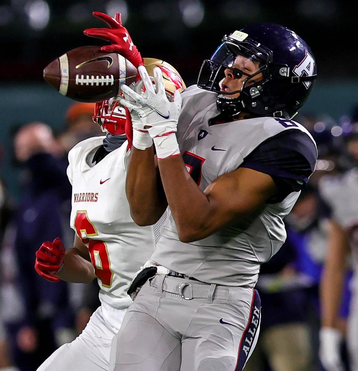 Allen receiver Blaine Green (8) can’t come up with a reception against South Grand Prairie defensive back Michael Booker (6) after making a reception during the first half of the 6A Division I Area round high school football playoffs, December 18, 2020, played at Globe Life Park in Arlington, Tx. (Steve Nurenberg Special to the Star-Telegram)