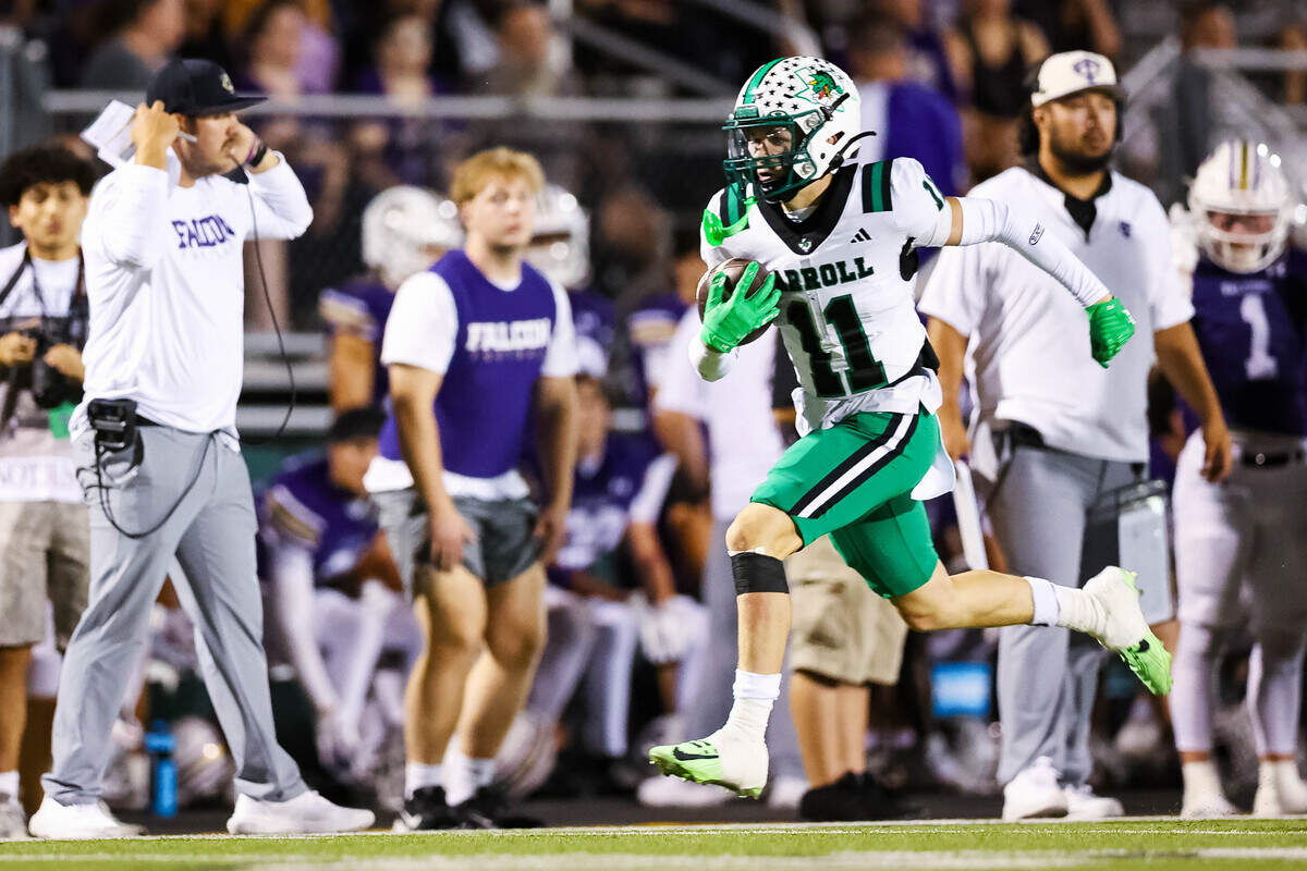 Southlake Carroll defensive back Taevin Kunz (11) runs with the ball after making an interception that would result in a touchdown in a district matchup against Keller Timber Creek on Thursday, September 25, 2025 at Keller ISD Stadium in Keller, Texas.