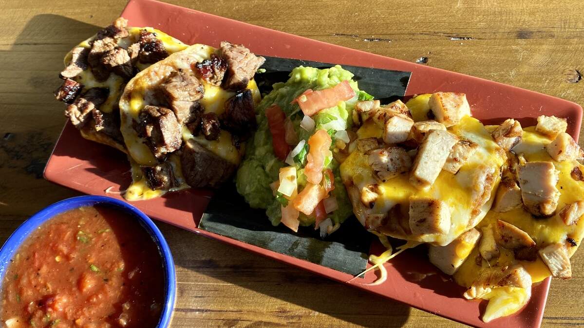 A lunch half-order of nachos with plenty of above-average guacamole at Blue Goose Cantina.