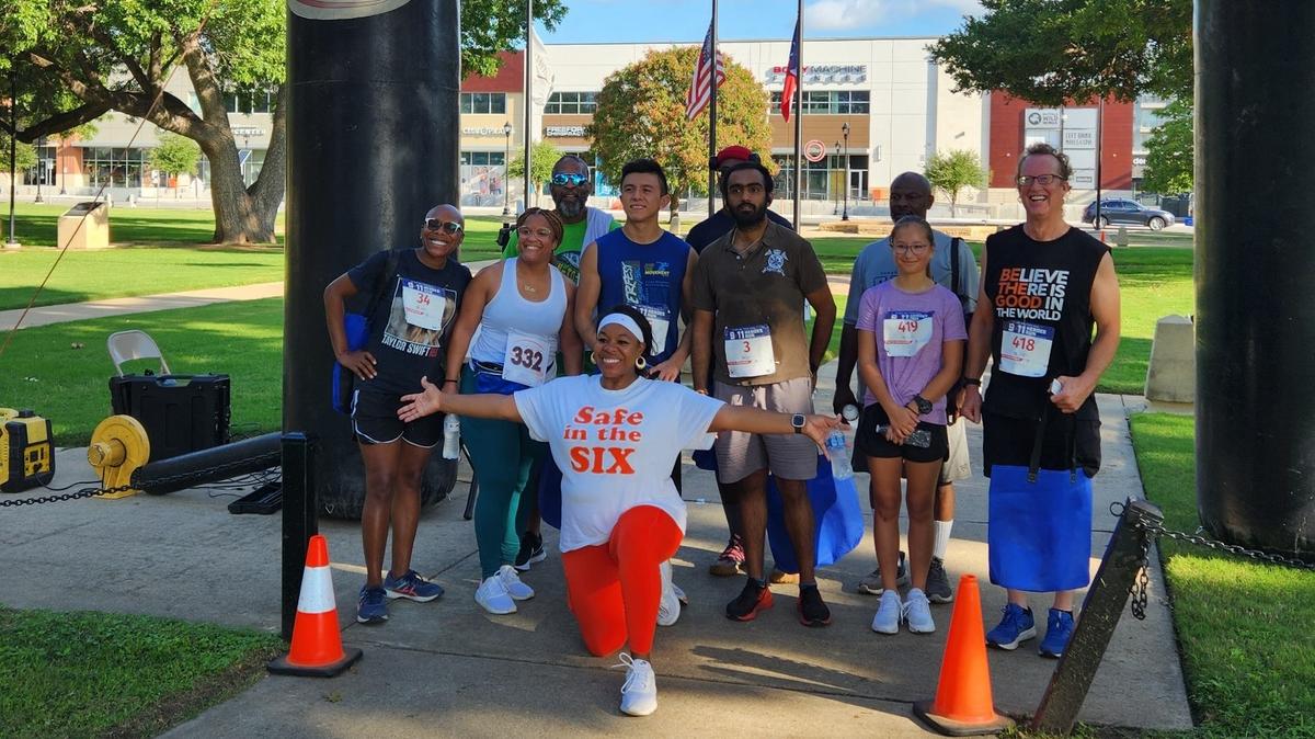 Teena James, center, poses with other participants during last year’s Human Sex Trafficking and Mental Health Walk for Awareness in the Stop 6 neighborhood.