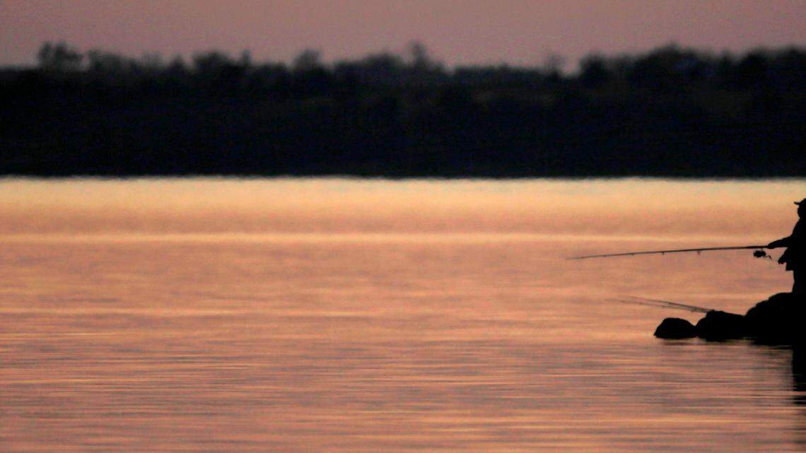 The 18-foot boat was found at the bottom of the lake, officials said. (AP Photo/Charlie Riedel)