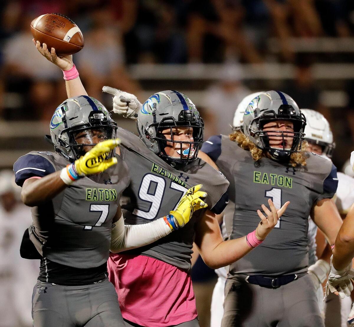 Eaton defensive tackle Kaden Cochran (97) thinks he just recovered a fumble flanked by team mates defensive end Israel Kiwabonga (7) and linebacker Brock Hayward (1) in a high school district 4-6A football game at NWISD Stadium in Justin, Texas, Friday Oct. 08, 2021. Eaton defeated Keller 43-21. (Special to the Star-Telegram Bob Booth)