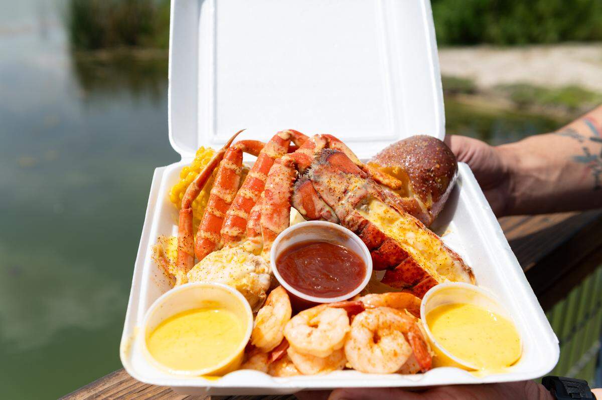 A plate of food from Te’jun, a seafood restaurant mixing Texas and Cajun flavors. Te’jun serves a variety of seafood, including crawfish, crab, shrimp, lobster and fish.