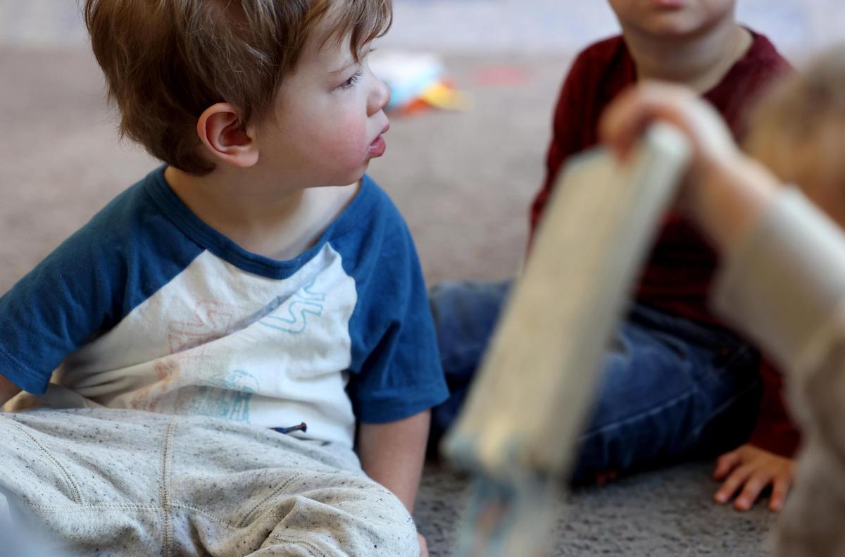 Charles, 2, listens to a story being read while being cared for at Kids’ Place Child Development Center on Wednesday, Jan. 15, 2025, in Fort Worth.