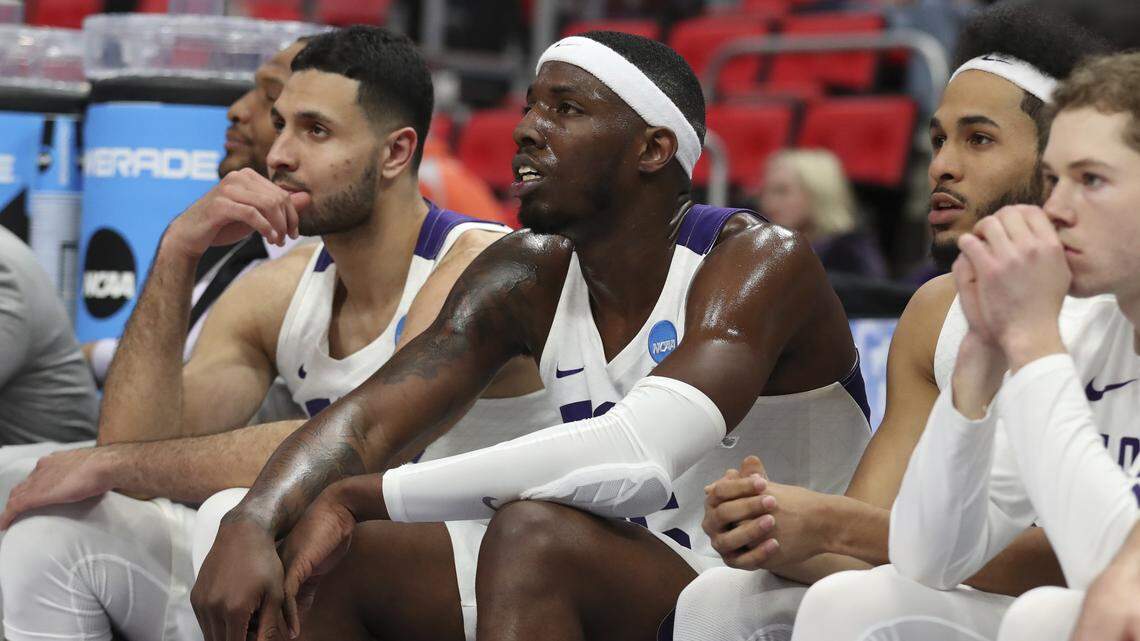 TCU forward Ahmed Hamdy, left, JD Miller, center, and guard Shawn Olden watch as the final seconds ticked down on the Horned Frogs' historic season. TCU lost 57-52 to Syracuse in the first round of the NCAA tournament in Detroit.