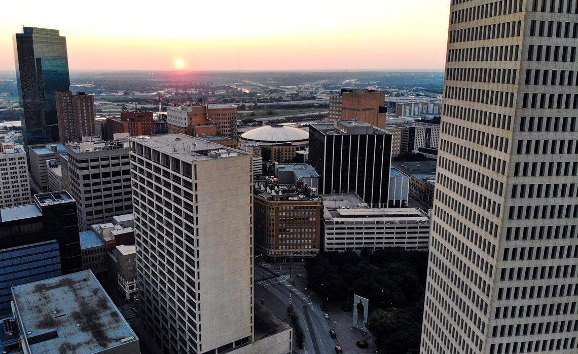 The Fort Worth Convention Center’s iconic flying saucer-like dome can be seen among other downtown buildings as the sun rises in 2022.