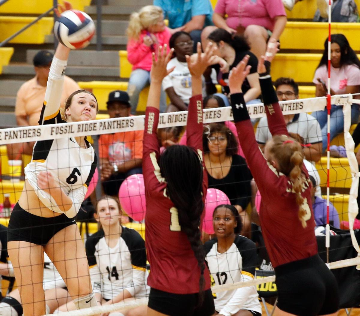 Fossil Ridge middle hitter Lainee Pyles (6) scores a point past Keller Central middle blocker Kira Smith (14) and setter Cadence Moore (8) during the second game in a three-out-of-five District 4-6A high school volleyball game at Fossil Ridge High School in Fort Worth Texas, Tuesday, Oct. 04, 2022. Fossil Ridge defeated Keller Central in three straight games, 25-21, 25-20 and 25-21. (Special to the Star-Telegram Bob Booth)