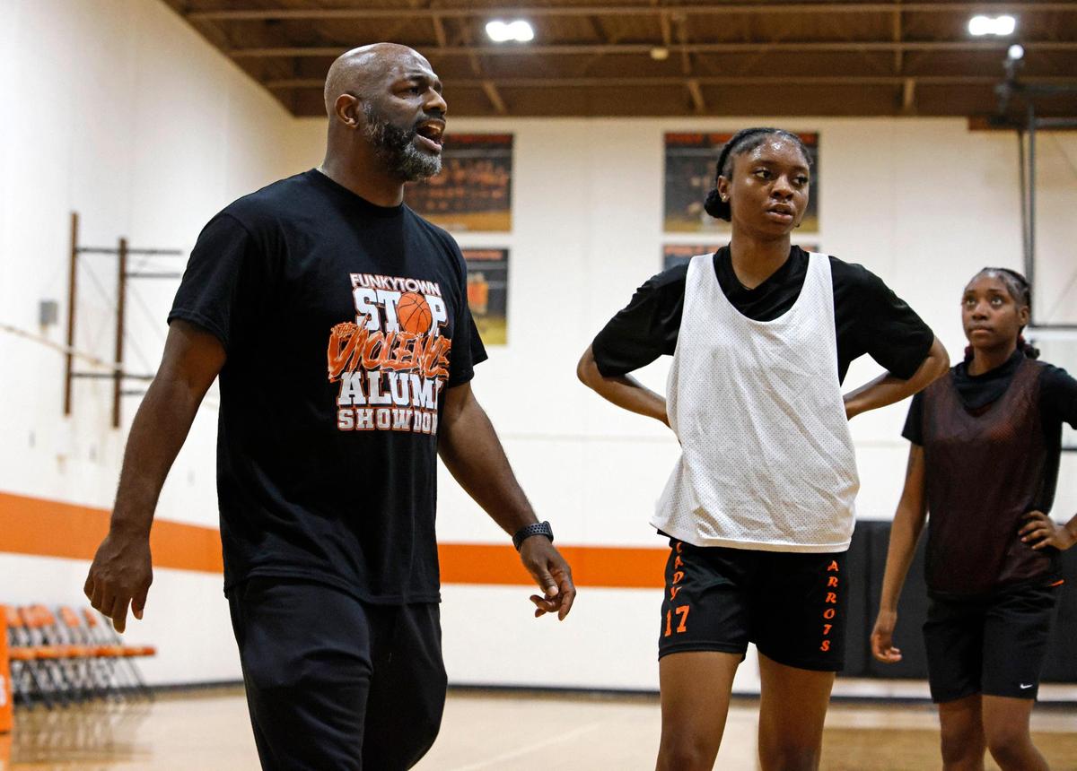 Head coach Nathaniel Hollis instructs the team during a three-on-three game during practice at Polytechnic High School outside gym in Fort Worth, Texas, Thursday, Feb. 06, 2025.