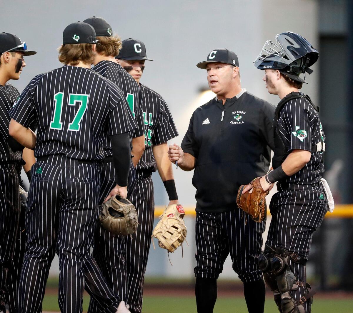 Carroll head coach Larry Vucan talks with the team during a time out during a UIL 6A Region I bi-district playoff baseball game at Carroll Senior High School in Southlake, Texas, Thursday, May 05, 2022. Carroll defeated Bell to move on to the area round. (Special to the Star-Telegram Bob Booth)