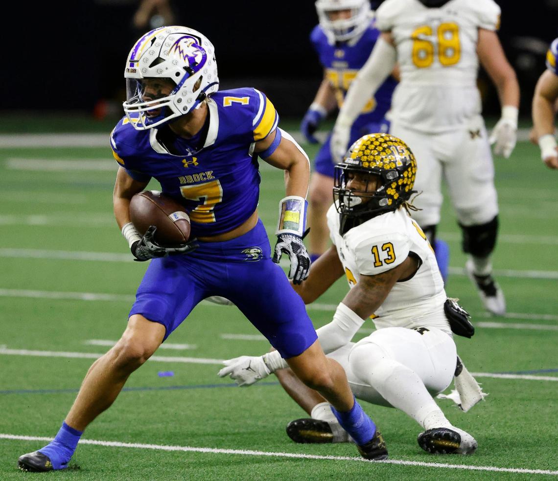 As Brock wide receiver Colt Matlock (7) makes a catch Malakoff defensive back Kayland Davis (13) misses the tackle during the first half of a UIL Conference 3A Division 1 semifinal playoff football game at The Ford Center in Frisco, Texas, Thursday, Dec. 07, 2023.