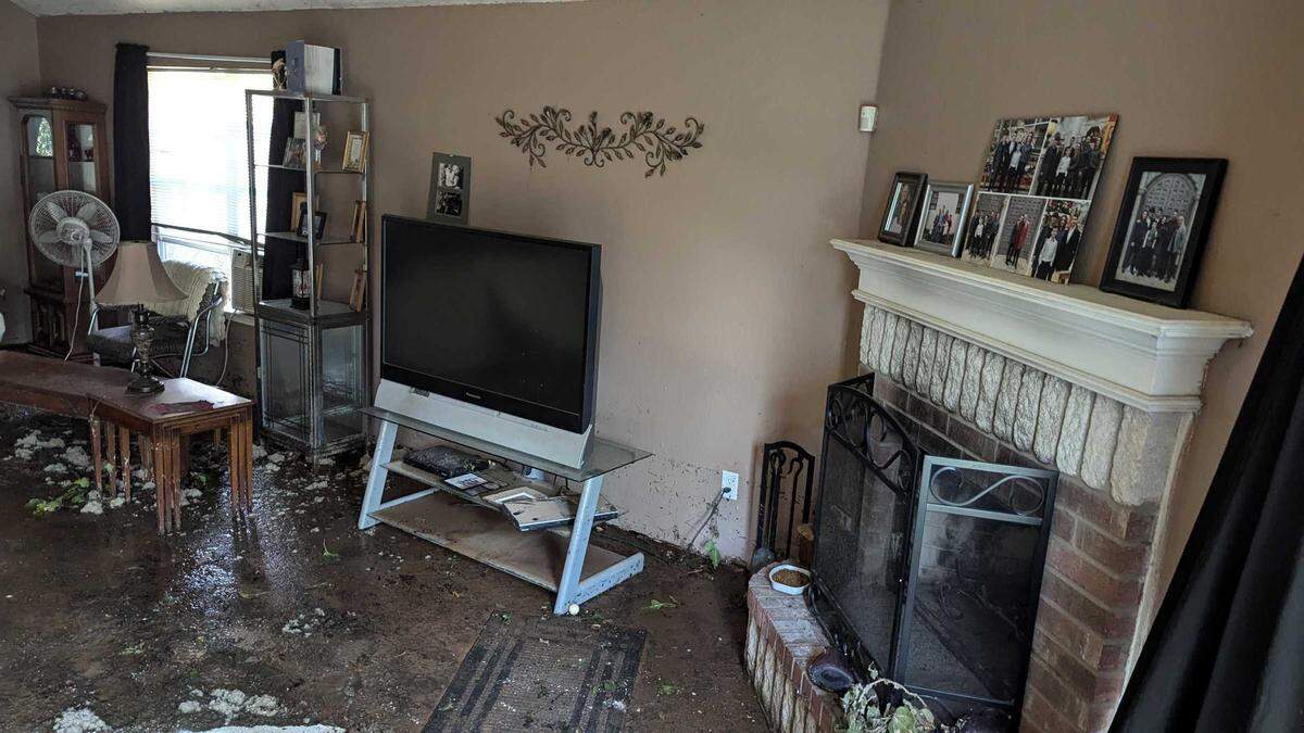 Susie Clark, who has lived at 8604 Trinity Vista Trail for 23 years, showed the Star-Telegram the damage to her living room. Clark said she came home to a “Yellowstone geyser” shooting onto her house.