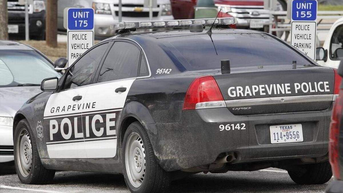 A suspect was injured after he crashed his car when an officer shot at him Tuesday after he hit multiple vehicles during a chase, Grapevine police said.
