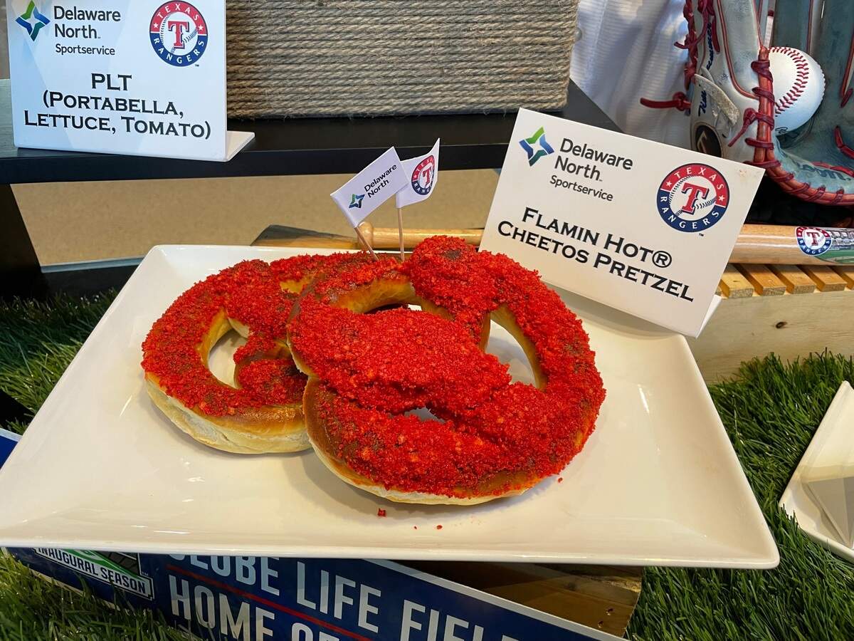 A pretzel is coated with Flamin Hot Cheetos dust and crushed pieces to create this item.