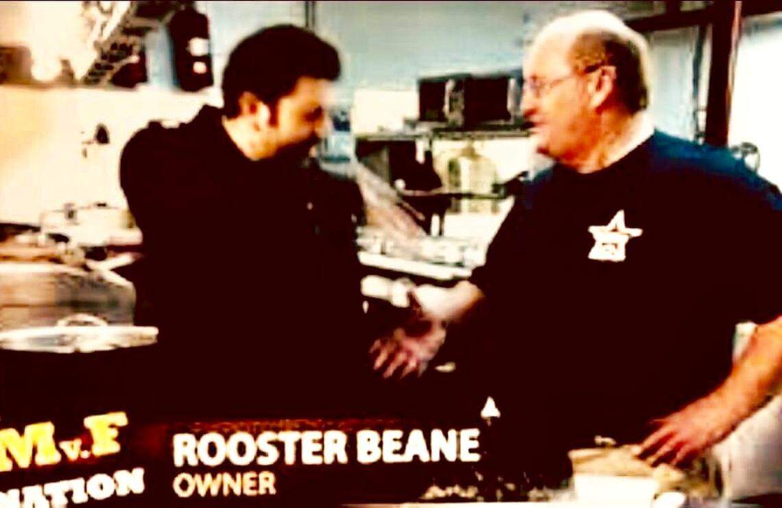 A screen grab from a 2011 “Man v. Food” episode featuring pitmaster Rooster Beane, then in Nashville and opening in Cresson.