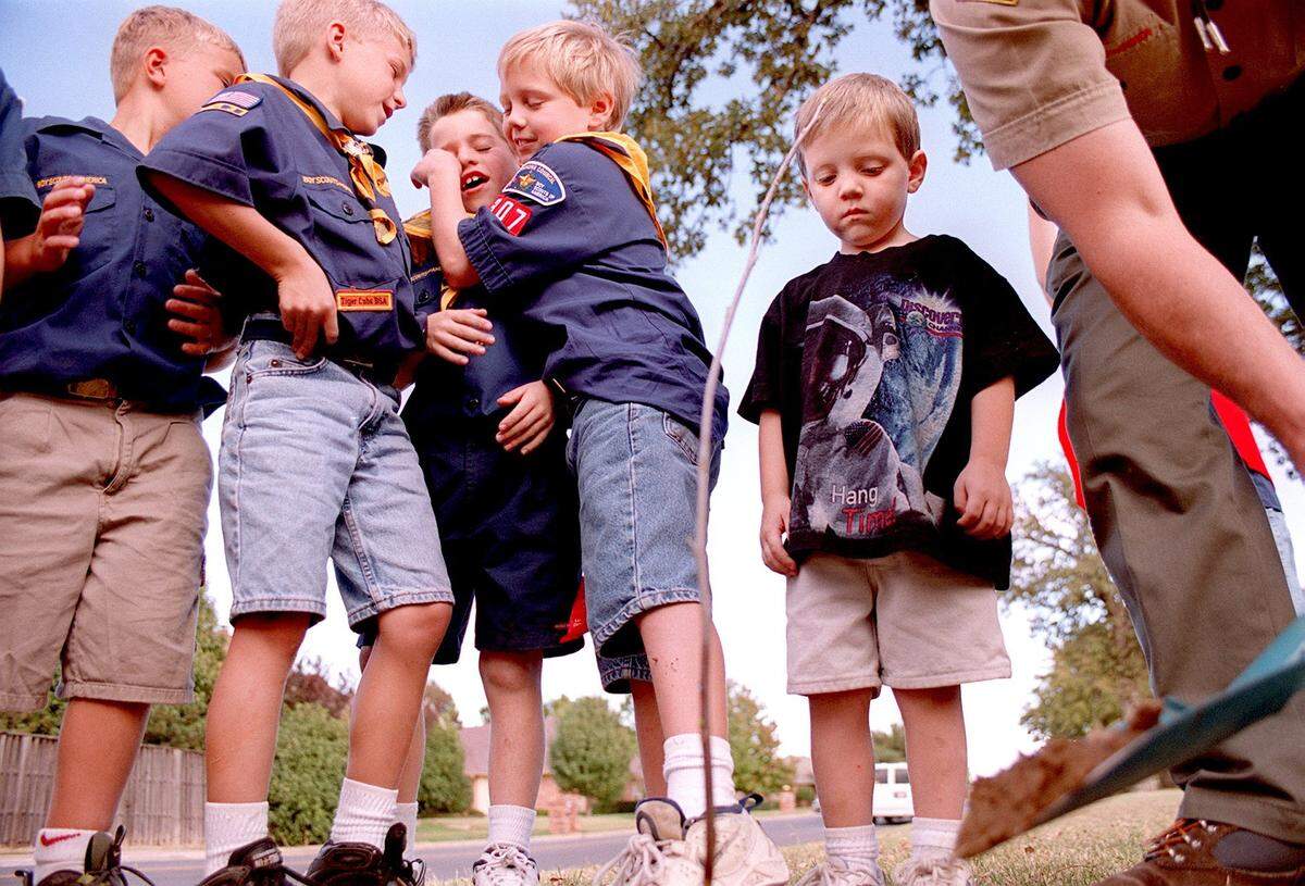 Oct. 27, 1999: Cullen Shipp, 3, watches as Jonathan Masterson shovels extra dirt onto a tree planted by members of Boy Scouts Den 3 Pack 307. The tree was planted in front of Spring Garden Elementary in Bedford.