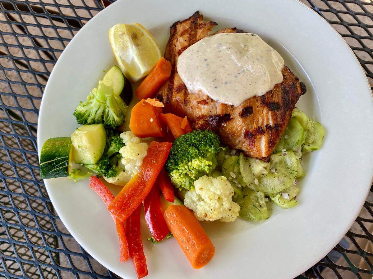 Charleston’s salmon is marinated, smoked briefly and grilled. (It comes with a side salad for less than $30.)