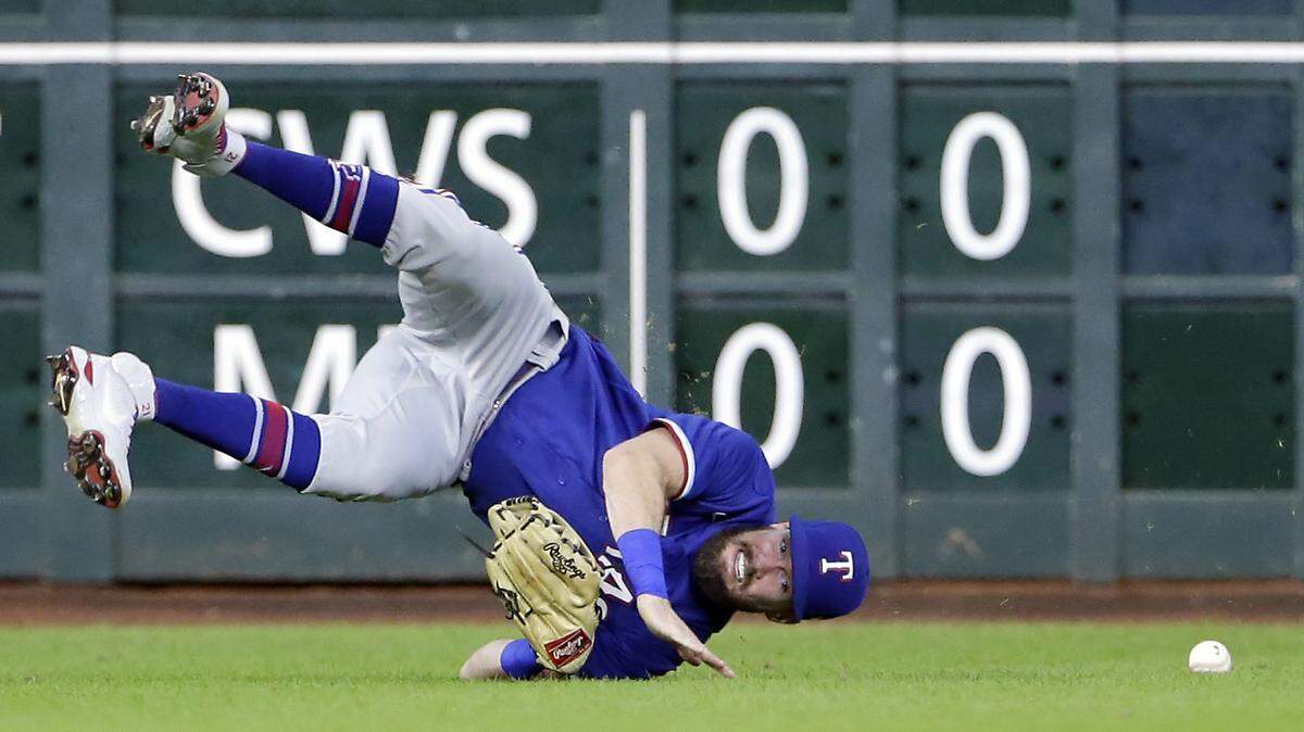 Texas Rangers left fielder David Dahl tumbles on a diving catch-attempt Friday in a loss to the Houston Astros at Minute Maid Park. It was the Rangers 10th consecutive loss, the longest losing streak for the team since 1995 and tied for the third longest in club history.