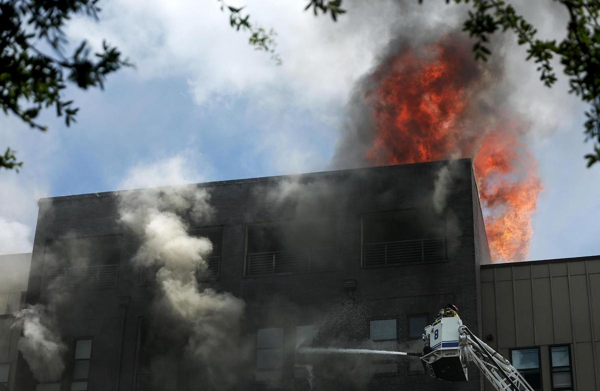 The Fort Worth Fire Department responds to a six-alarm fire at The Cooper apartment complex in the 1000 block of West Rosedale on Monday, June 23.