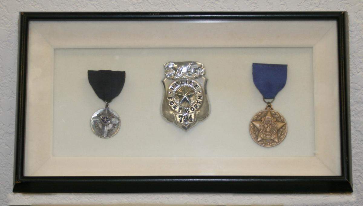 Slain Fort Worth patrol Officer Edward Belcher’s badge, medal of honor and police cross had been on display for years in the chief’s office of the former police headquarters.