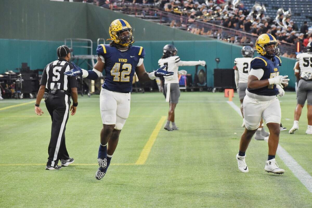Arlington Lamar running back Braylon Williams, left, celebrates a first-quarter touchdown run against Arlington Martin in a UIL football Class 6A game at Choctaw Stadium in Arlington on Thursday, Sept. 18, 2025.