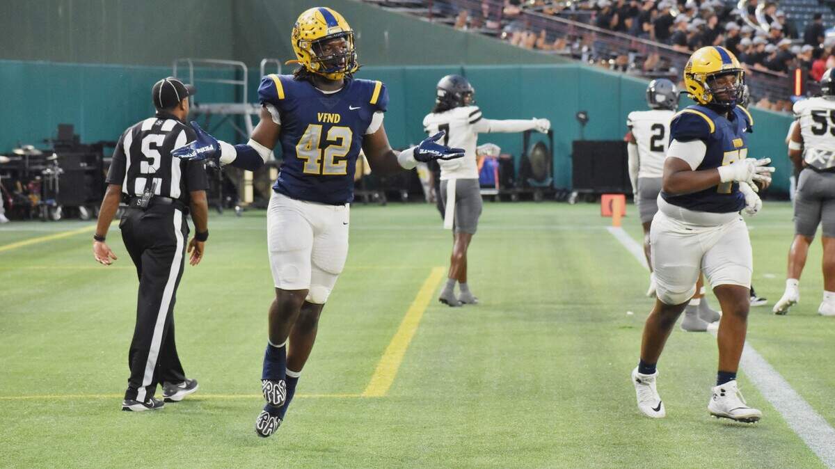 Arlington Lamar athlete Braylon Williams, left, celebrates a first-quarter touchdown run against Arlington Martin in a UIL football Class 6A game at Choctaw Stadium in Arlington on Thursday, Sept. 18, 2025.